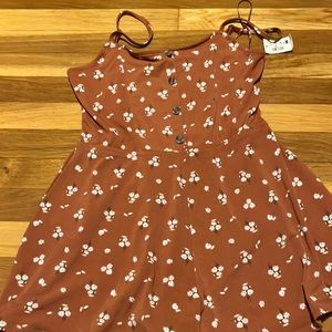 Never worn and looks like a dress on even though it’s a romper